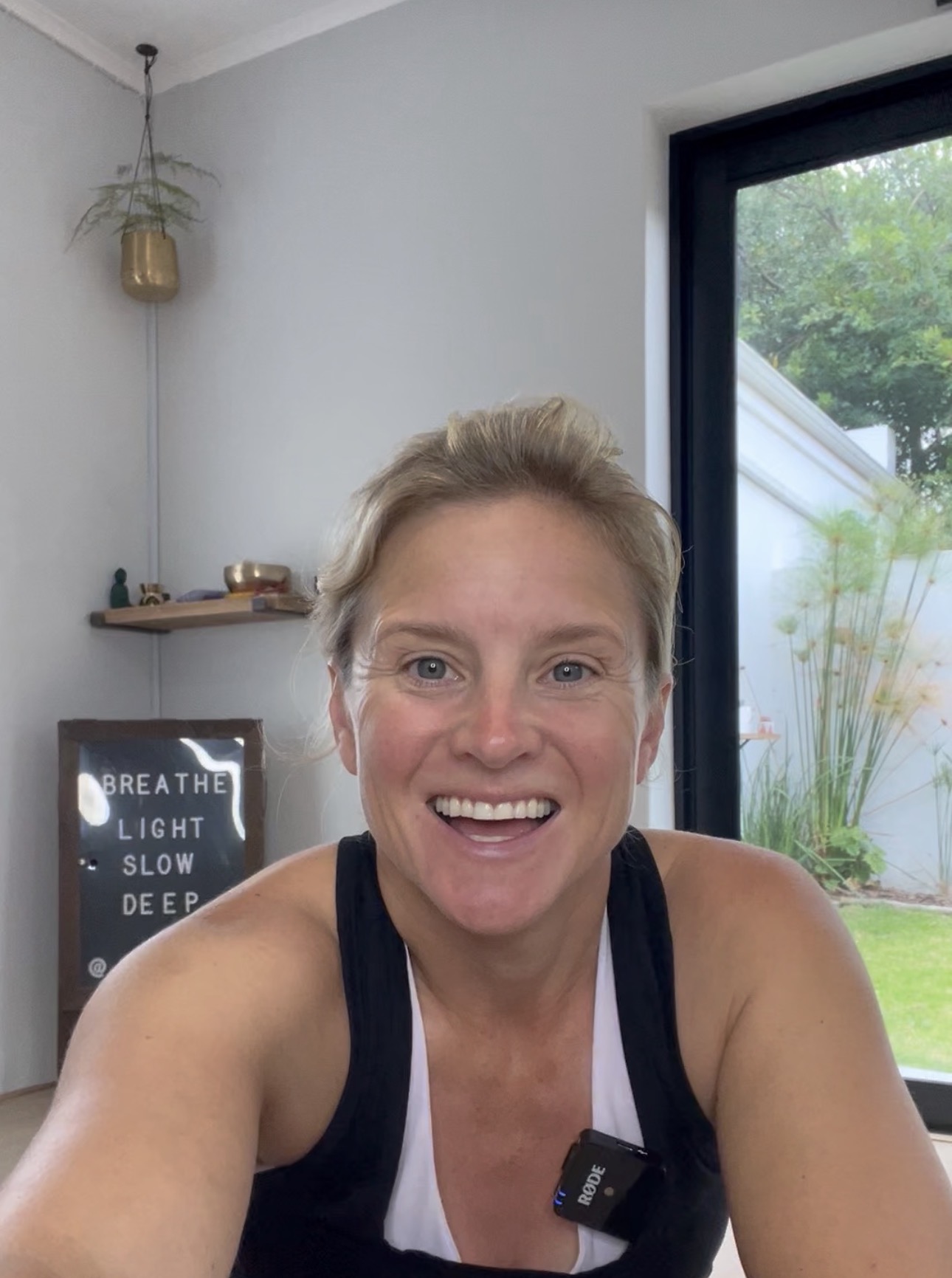 Eloise Frey smiling in her coaching studio