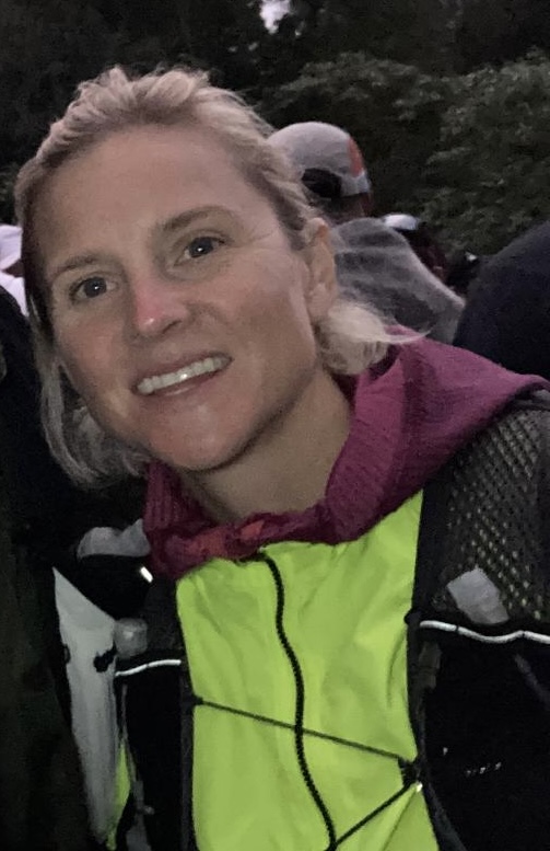 Eloise Frey outdoors in her trail-running jacket and hydration vest
